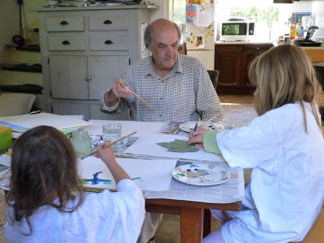 Photo of Francois Hugo painting with his grandchildren